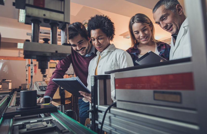 Group of people observing a certification document 